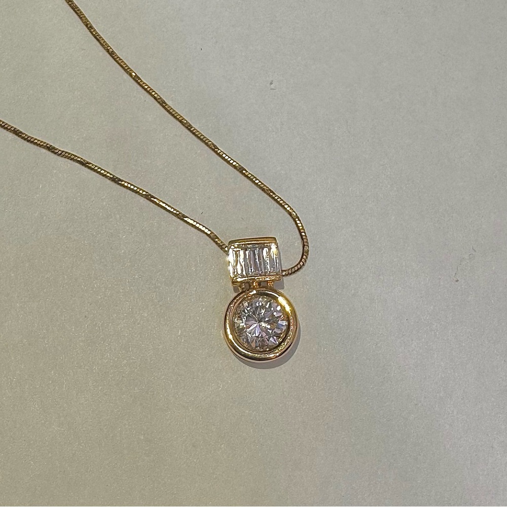 14k yellow gold CZ solitaire with a baguette slide necklace.
